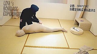 Asian babe gagged and enclosed in pantyhose for humiliation.